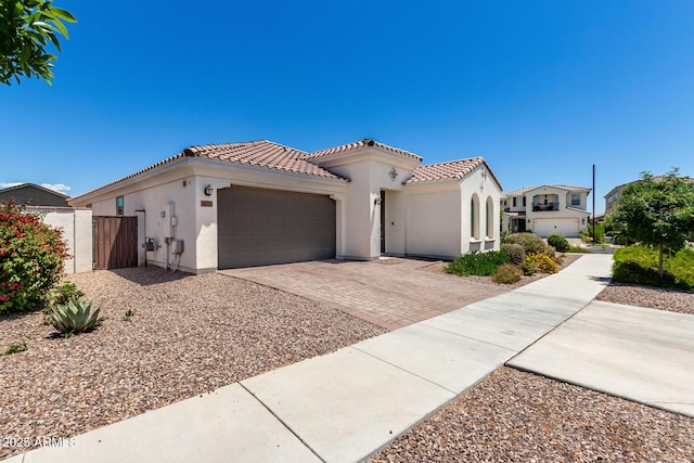 4051 S Galaxy Ln, Mesa, AZ 85212 - view of front of home featuring a tiled roof, stucco siding, an attached garage, and decorative driveway