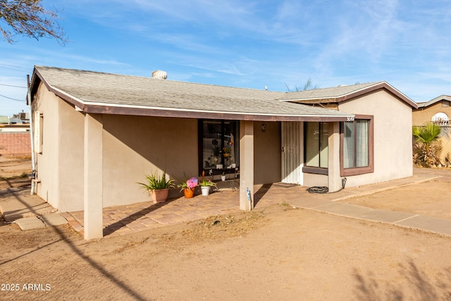 back of house with a patio