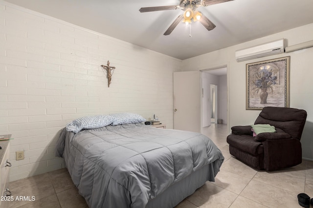 bedroom with light tile patterned flooring, brick wall, and a wall mounted air conditioner