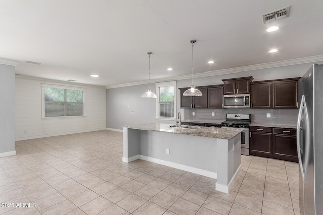kitchen with crown molding, dark brown cabinets, appliances with stainless steel finishes, a sink, and visible vents