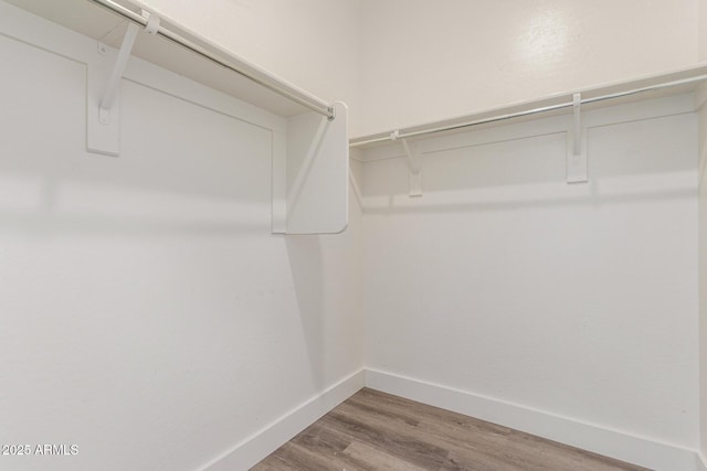 spacious closet with wood finished floors