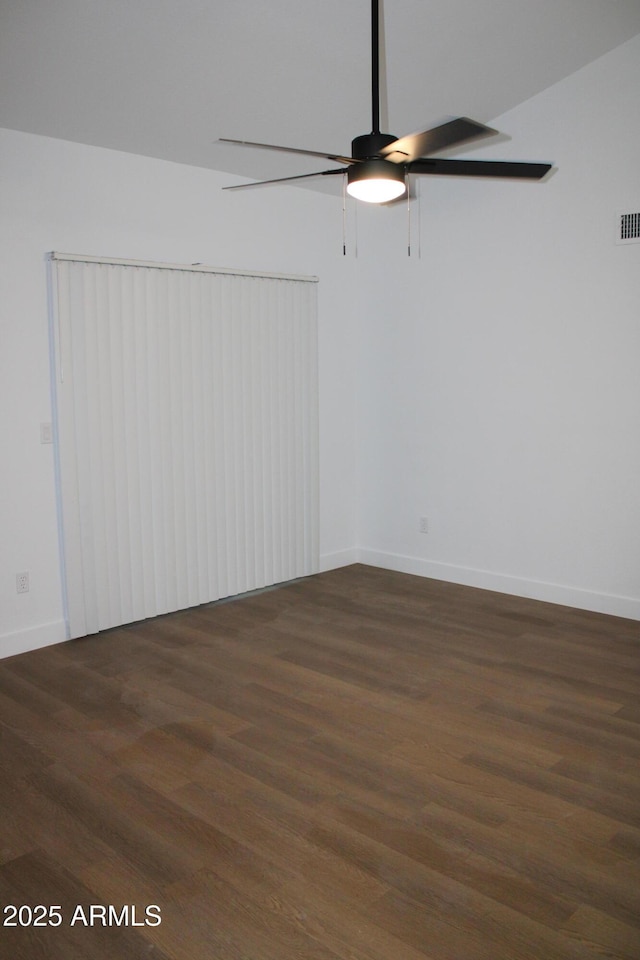 unfurnished room featuring wood finished floors and baseboards