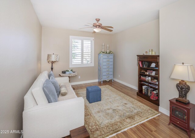 6975 E Lynx Wagon Rd, Prescott Valley, AZ 86314 - sitting room with a ceiling fan, wood finished floors, and baseboards
