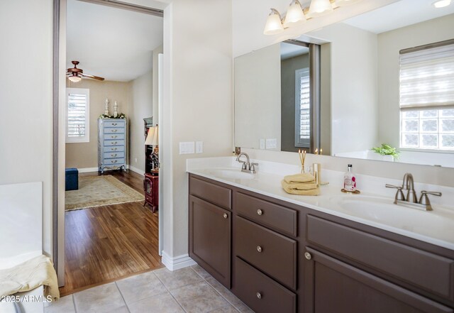 6975 E Lynx Wagon Rd, Prescott Valley, AZ 86314 - bathroom featuring a wealth of natural light, tile patterned flooring, and a sink