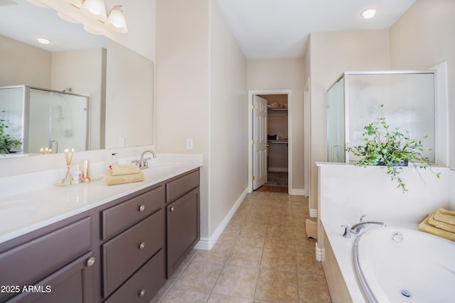 6975 E Lynx Wagon Rd, Prescott Valley, AZ 86314 - full bath with a sink, a stall shower, a spacious closet, and tile patterned floors