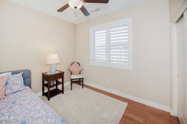 6975 E Lynx Wagon Rd, Prescott Valley, AZ 86314 - bedroom with visible vents, a ceiling fan, baseboards, and wood finished floors