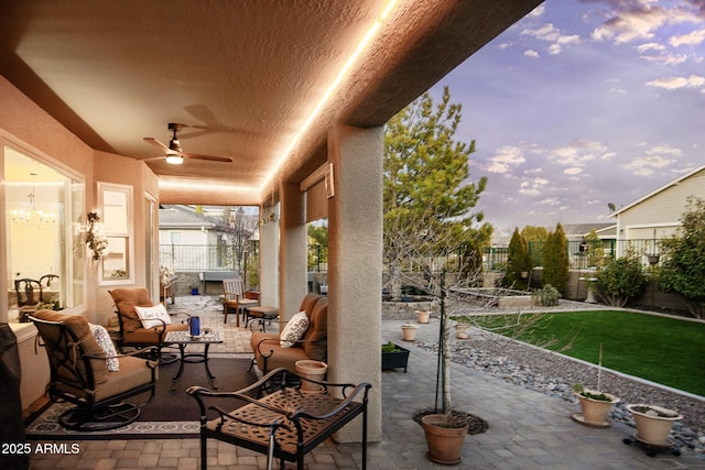 6975 E Lynx Wagon Rd, Prescott Valley, AZ 86314 - view of patio / terrace with ceiling fan, outdoor lounge area, and fence