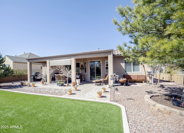 6975 E Lynx Wagon Rd, Prescott Valley, AZ 86314 - back of property with stucco siding, a lawn, a patio area, and fence