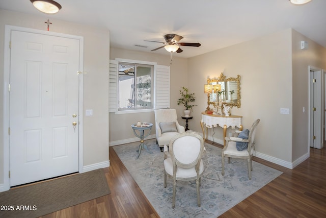 entryway featuring a ceiling fan, wood finished floors, and baseboards