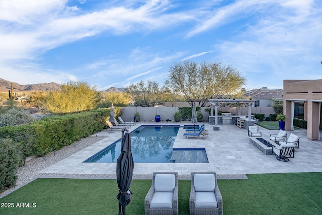 view of pool featuring a yard, a pergola, a jacuzzi, and a mountain view