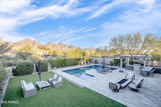 view of pool featuring a lawn, a pergola, a mountain view, a grill, and a patio area