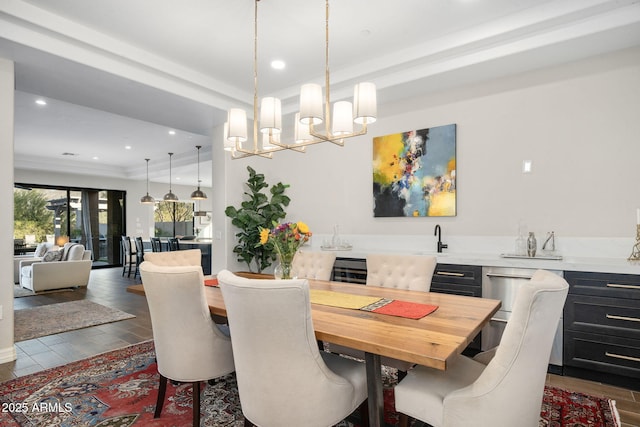 dining room with a raised ceiling and a notable chandelier