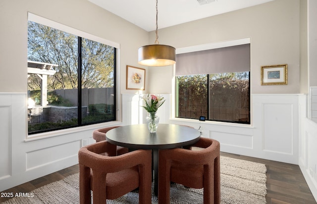 dining area featuring dark hardwood / wood-style floors