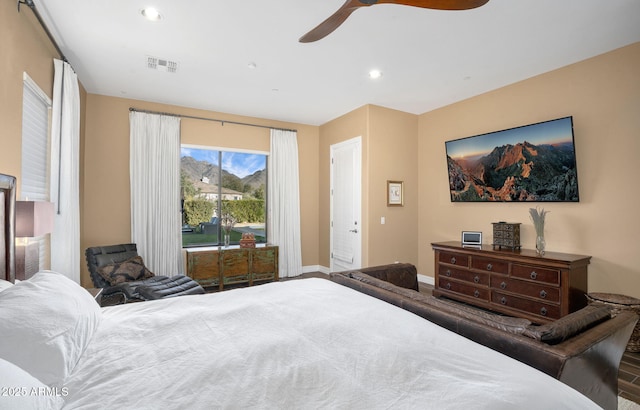 bedroom with ceiling fan, hardwood / wood-style flooring, and access to exterior