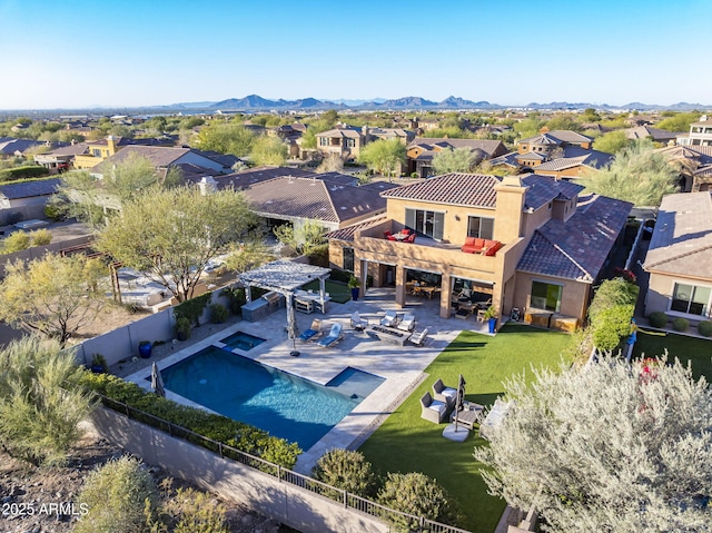 birds eye view of property with a mountain view