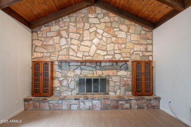 405 E Stanford Ave, Gilbert, AZ 85234 - detailed view of wood ceiling with exposed beams, wood finished floors, baseboards, wood walls, and a stone fireplace