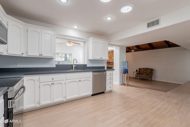 405 E Stanford Ave, Gilbert, AZ 85234 - kitchen featuring stainless steel appliances, a sink, dark countertops, white cabinets, and recessed lighting