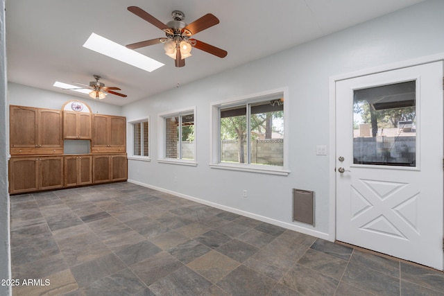 405 E Stanford Ave, Gilbert, AZ 85234 - foyer entrance featuring a ceiling fan, a skylight, baseboards, and lofted ceiling