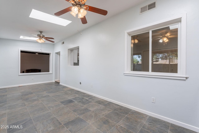 405 E Stanford Ave, Gilbert, AZ 85234 - empty room featuring a ceiling fan, baseboards, and a skylight