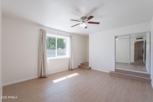 405 E Stanford Ave, Gilbert, AZ 85234 - unfurnished room featuring ceiling fan, light wood finished floors, and baseboards