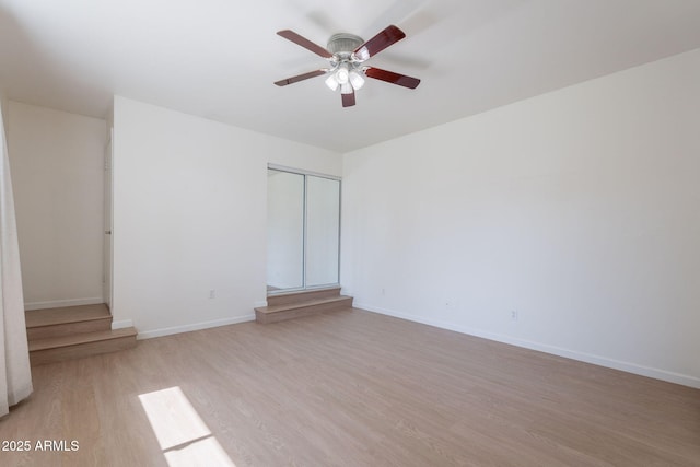 405 E Stanford Ave, Gilbert, AZ 85234 - empty room featuring light wood-type flooring, ceiling fan, and baseboards