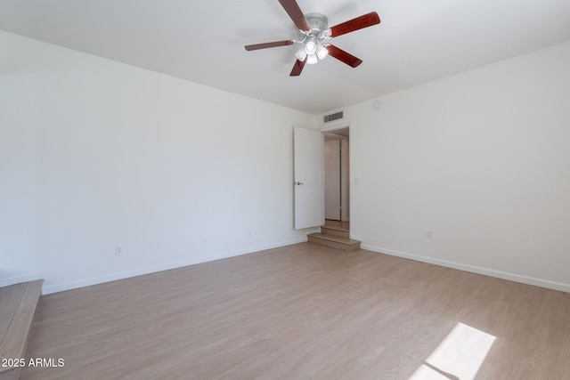 405 E Stanford Ave, Gilbert, AZ 85234 - spare room featuring a ceiling fan, light wood-style floors, and baseboards