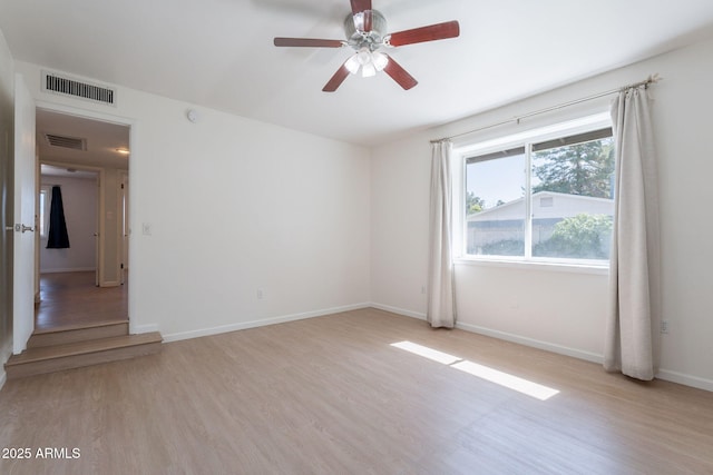405 E Stanford Ave, Gilbert, AZ 85234 - unfurnished room with light wood-style floors, a ceiling fan, and baseboards