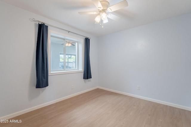 405 E Stanford Ave, Gilbert, AZ 85234 - spare room featuring light wood finished floors, baseboards, and a ceiling fan