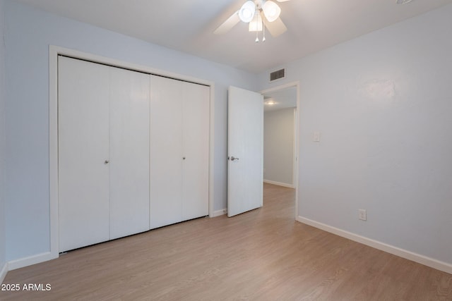 405 E Stanford Ave, Gilbert, AZ 85234 - unfurnished bedroom featuring wood finished floors, baseboards, a closet, and ceiling fan