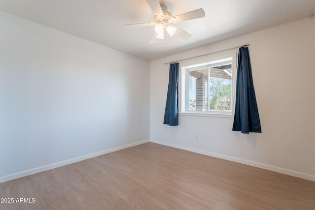 405 E Stanford Ave, Gilbert, AZ 85234 - unfurnished room with light wood-type flooring, baseboards, and a ceiling fan