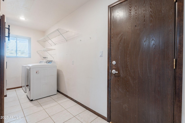 405 E Stanford Ave, Gilbert, AZ 85234 - laundry area with washer / dryer, baseboards, and light tile patterned flooring