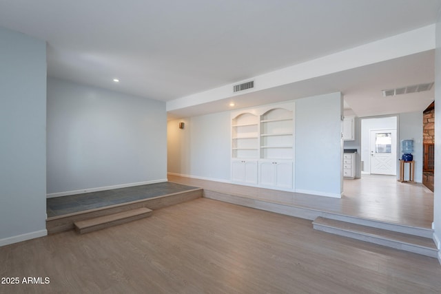 405 E Stanford Ave, Gilbert, AZ 85234 - spare room featuring baseboards, wood finished floors, built in features, and recessed lighting