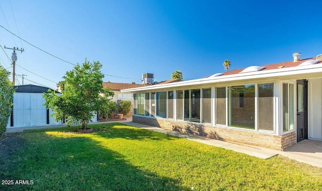 12431 N 30th Ave, Phoenix, AZ 85029 - view of grassy yard featuring a shed