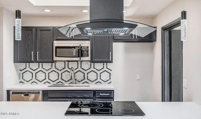 12431 N 30th Ave, Phoenix, AZ 85029 - kitchen featuring appliances with stainless steel finishes, island range hood, tasteful backsplash, light countertops, and recessed lighting