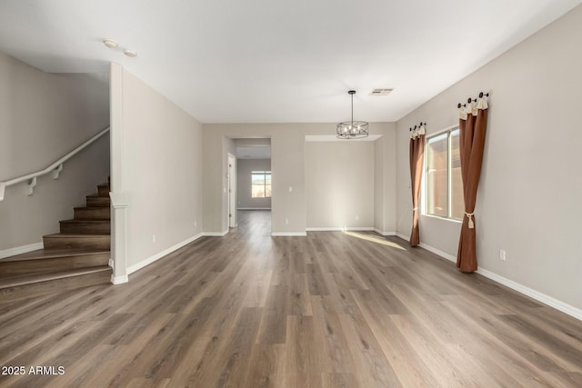 empty room featuring wood-type flooring