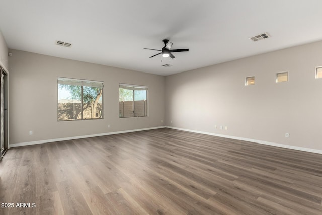 spare room featuring ceiling fan and wood-type flooring