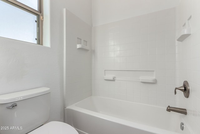 bathroom with toilet and shower / bathtub combination