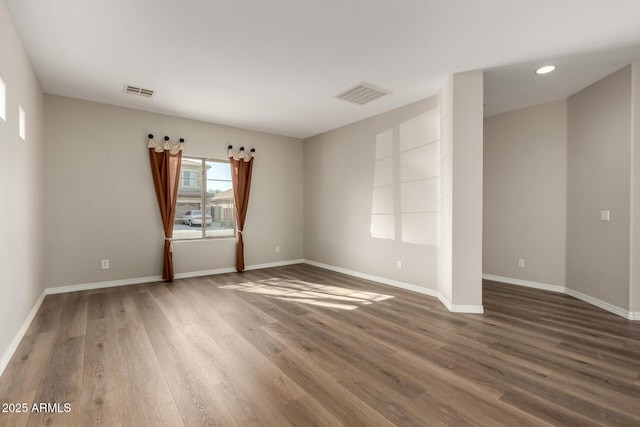 unfurnished room with dark hardwood / wood-style floors