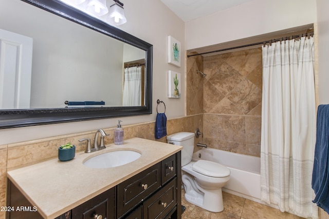 full bathroom featuring shower / bath combo, vanity, and toilet