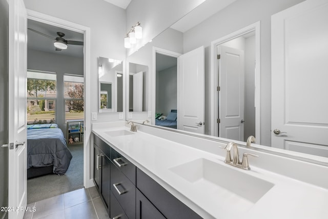 bathroom with tile patterned floors, ceiling fan, and vanity