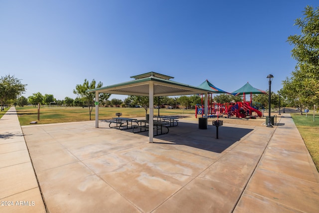 view of home's community with a lawn, a playground, and a gazebo