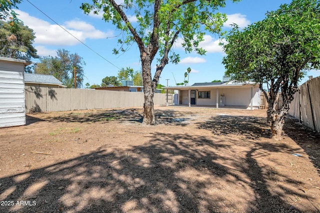 view of yard with a fenced backyard