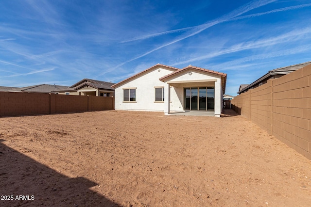 back of property featuring a patio