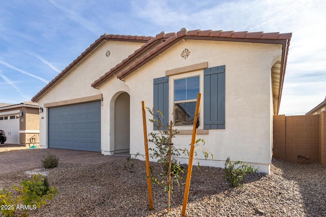 view of front of property with a garage