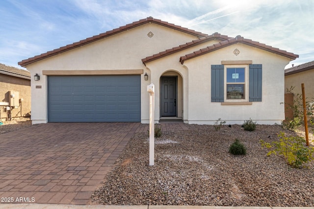 mediterranean / spanish-style home featuring a garage