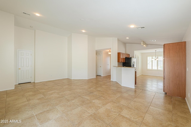 interior space featuring visible vents, recessed lighting, baseboards, and lofted ceiling