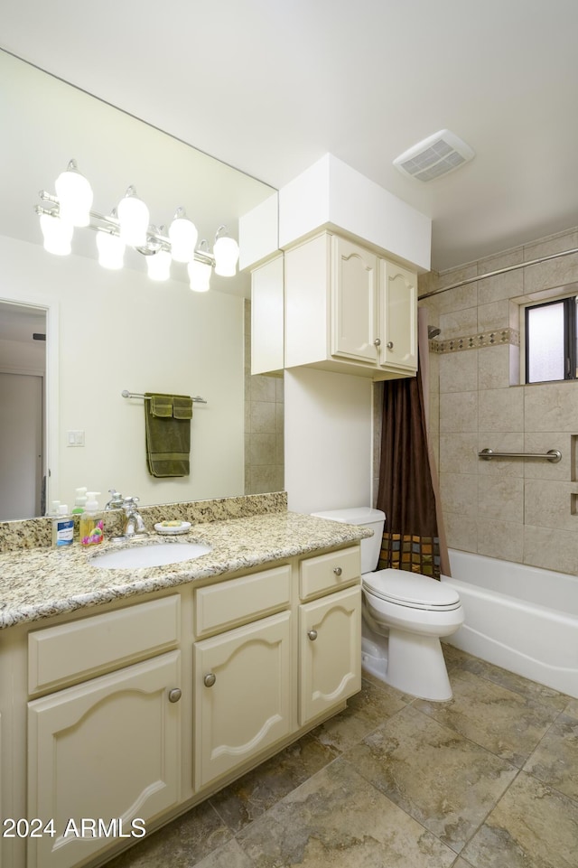 full bathroom featuring vanity, toilet, and shower / tub combo