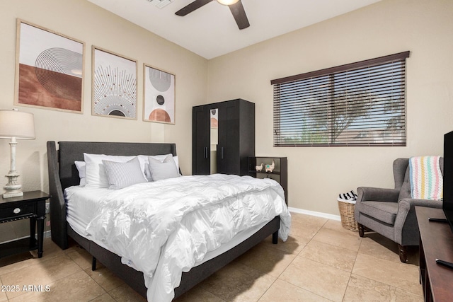 bedroom with baseboards, ceiling fan, light tile patterned flooring, and visible vents
