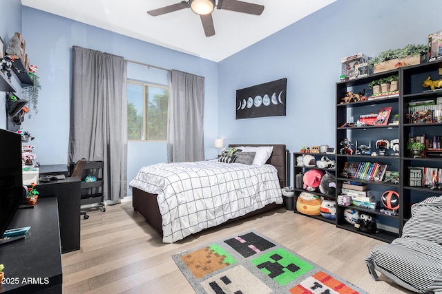 bedroom with a ceiling fan and wood finished floors