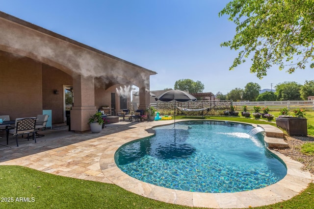 view of swimming pool featuring a fenced in pool, a patio area, and fence